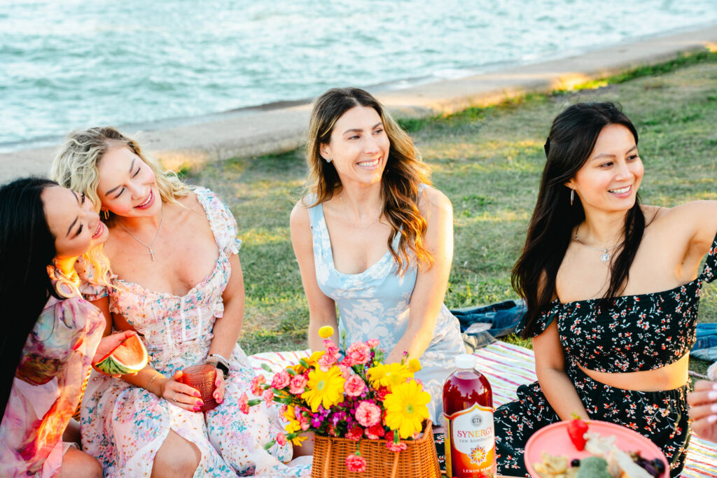 women at a picnic at Chicago's lakefront, smiling,